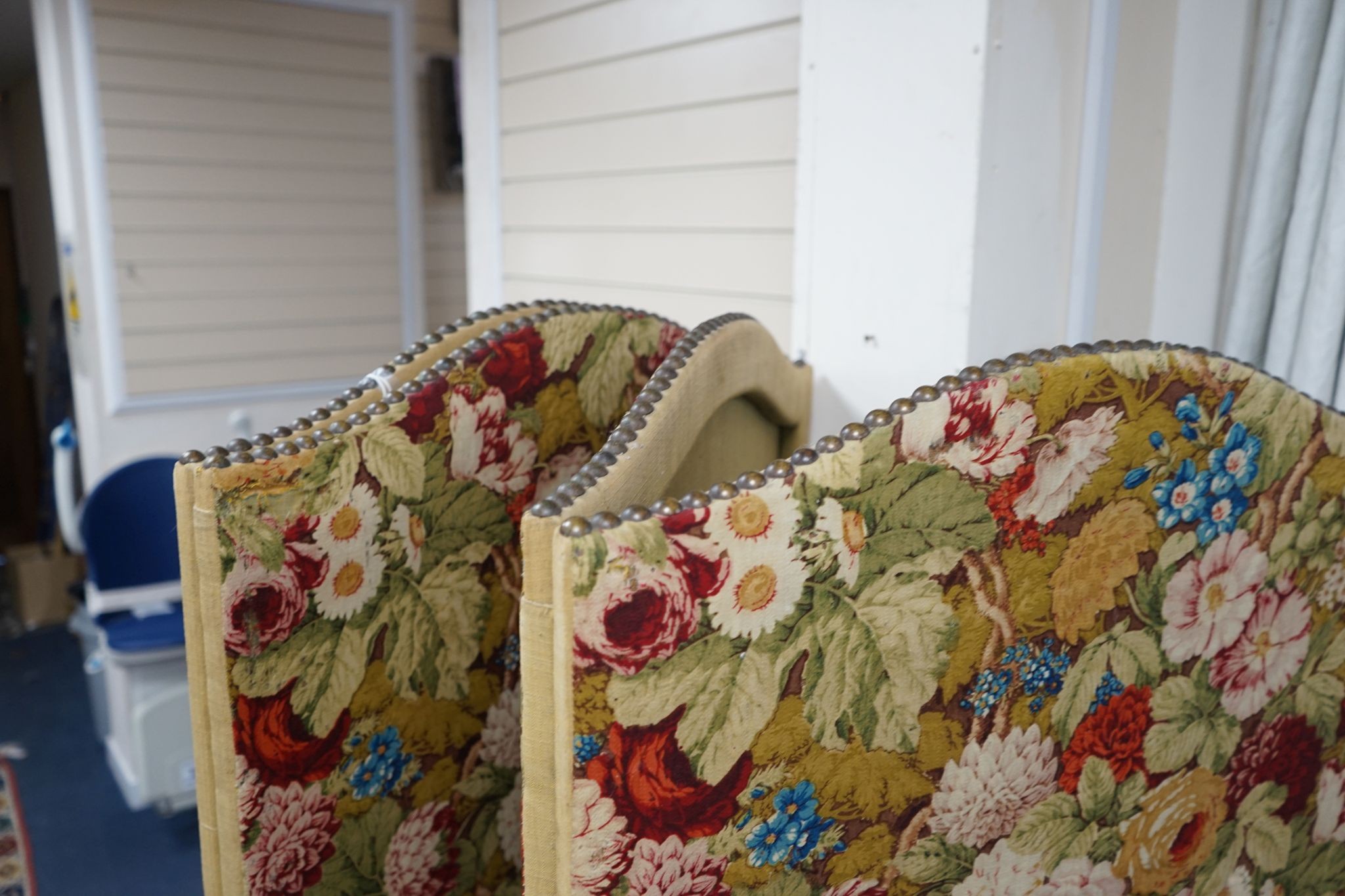 An early 20th century floral fabric four fold dressing screen, each panel width 67cm, height 176cm